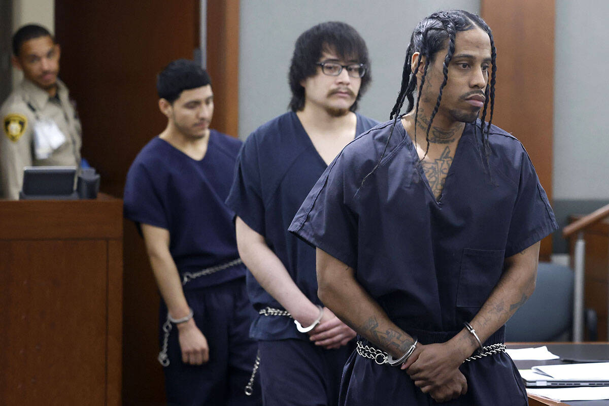 Gerald Oglesby, right, who pleaded guilty to the killing of his 5-year-old son in 2022, is led ...