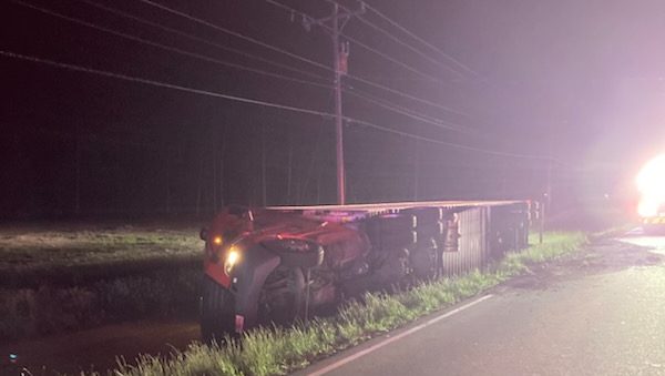 3-vehicle crash topples 18-wheeler carrying tons of ham