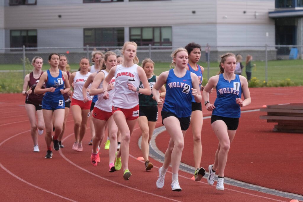 Juneau-Douglas High School: Yadaa.at Kalés Ida Meyer (1) and Sitkas Marina Dill (2) and Clare Mullin (1) lead the start of the combined DI and DII 3200 during the Region V Track & Field Championships Friday at Thunder Mountain Middle School. (Klas Stolpe / Juneau Empire)