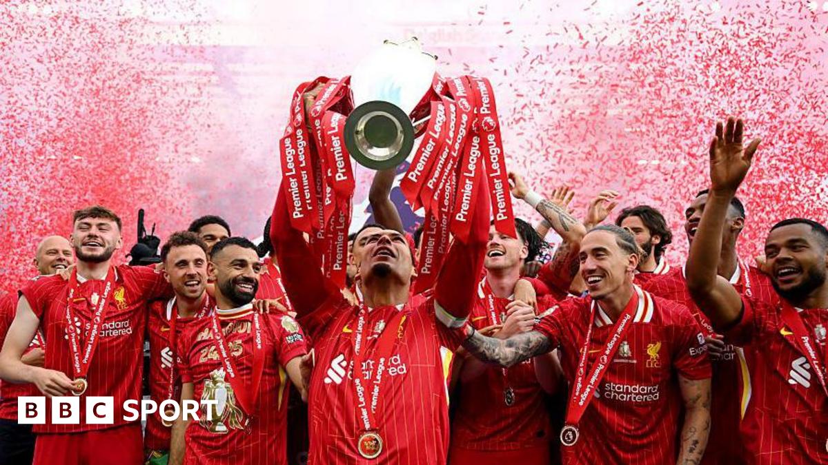 Liverpool captain Virgil van Dijk lifts the Premier League trophy after the game against Crystal Palace at Anfield