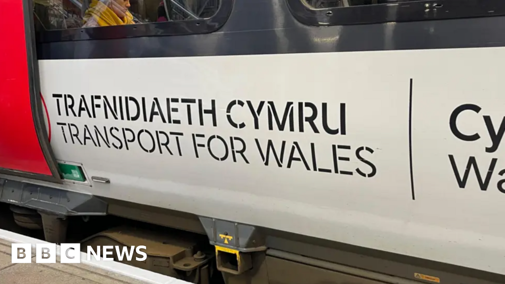 Rail lines at stop as train hits tractor