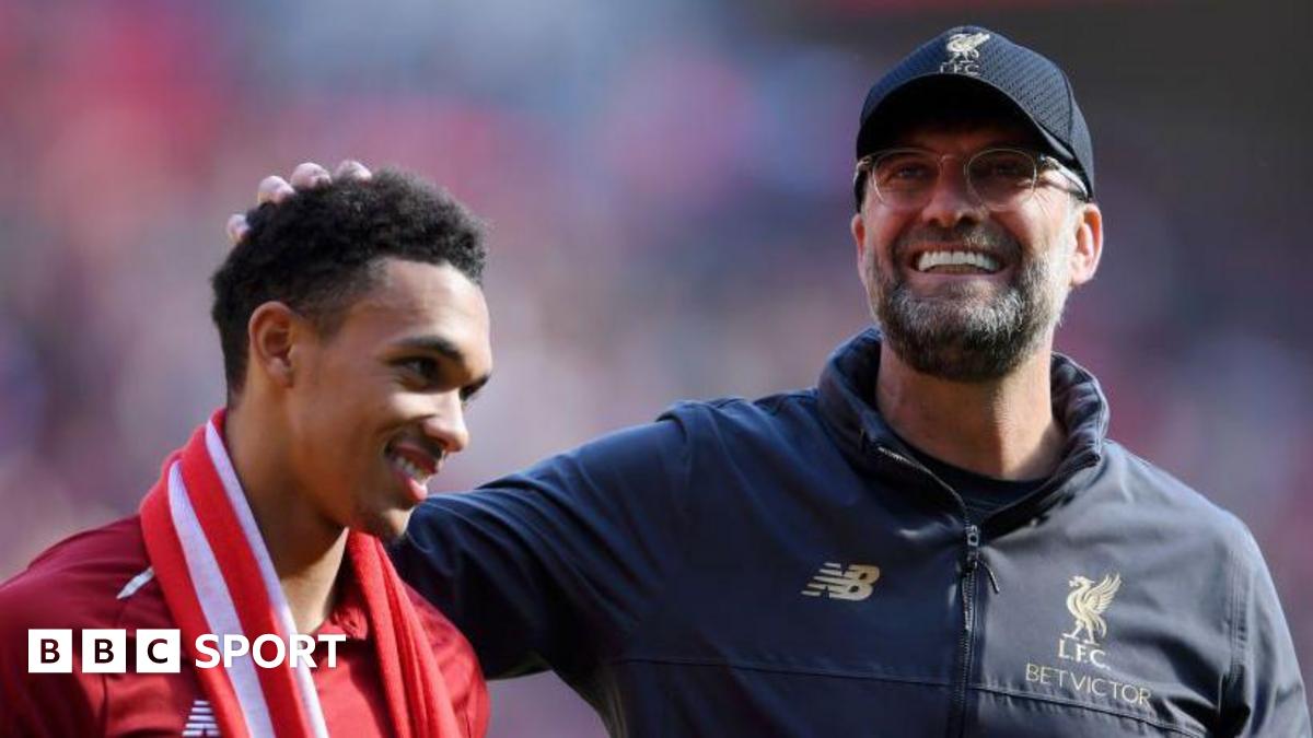 Jurgen Klopp, manager of Liverpool embraces Trent Alexander-Arnold of Liverpool
