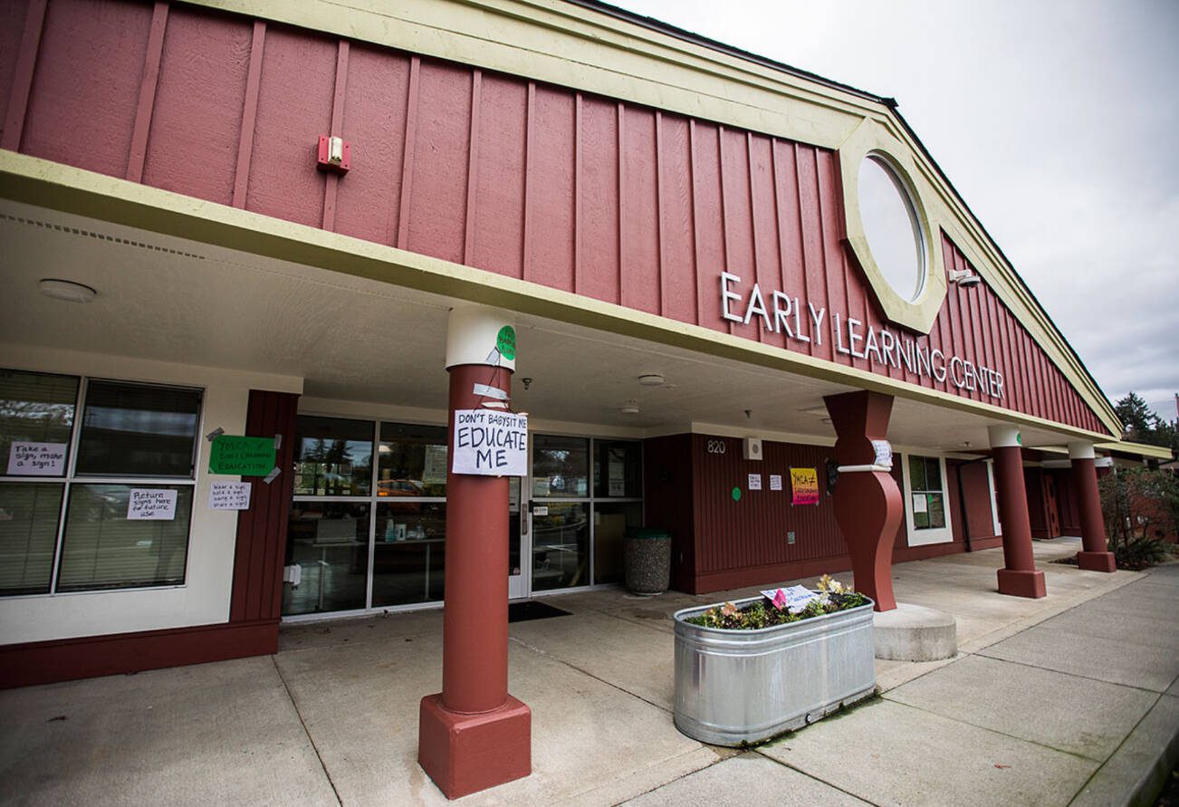 Signs hang on the outside of the Early Learning Center on the Everett Community College campus on Wednesday, Dec. 1, 2021 in Everett, Wa. (Olivia Vanni / The Herald)