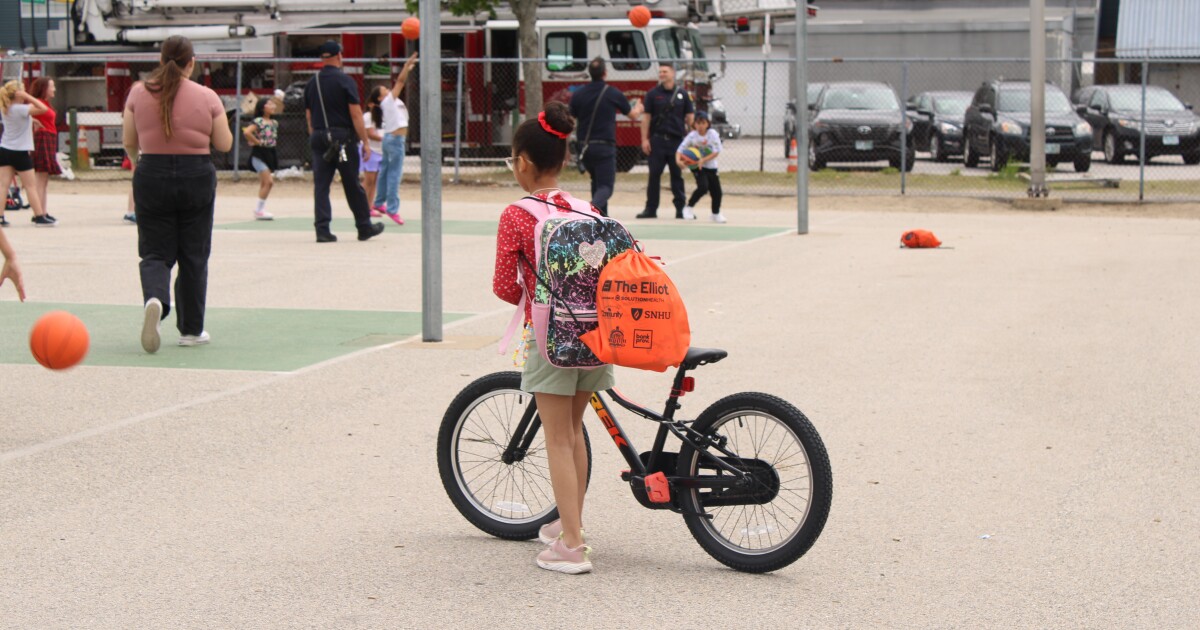 Manchester fourth graders earn refurbished bikes, basketballs and helmets