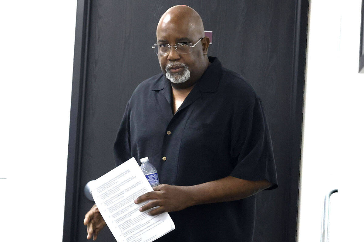 Dr. George Chambers, a local OB-GYN, enters the Nevada State Board of Medical Examiners office ...