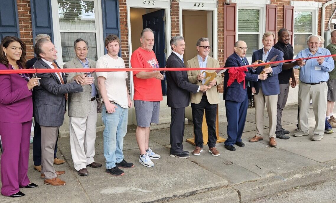 The Sunday Breakfast Mission celebrated the dedication of two newly rehabilitated homes developed in partnership with Habitat for Humanity of New Castle County. (Photo by Carol Houseal)