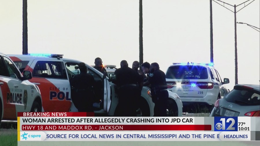 Woman arrested after allegedly crashing into JPD car