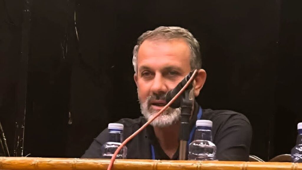 Former commander and activist Munif al-Qaddah at a community event in Daraa, Syria, after the fall of the regime (Enab Baladi/Mahjoub al-Hashish)