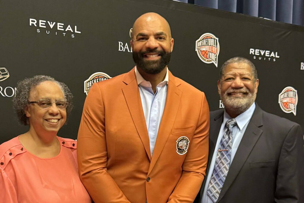 Renee Boozer, Carlos Boozer Jr. and Carlos Boozer Sr. attend the enshrinement ceremony at the Naismith Basketball Hall of Fame in Sprinfield, Massachusetts, on Saturday, Sept. 6, 2025. As a member of the 2008 U.S. men's Olympic team, Boozer Jr. is a member of the 2025 class. (Photo provided by Carlos Boozer Sr.)