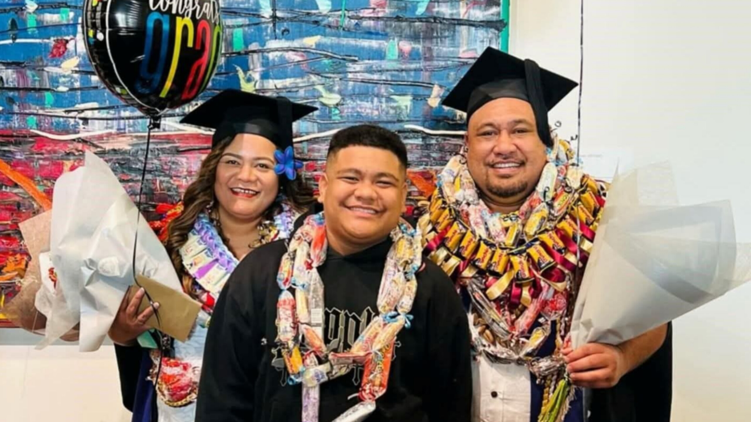 Couple Celebrate Academic Milestone Side by Side