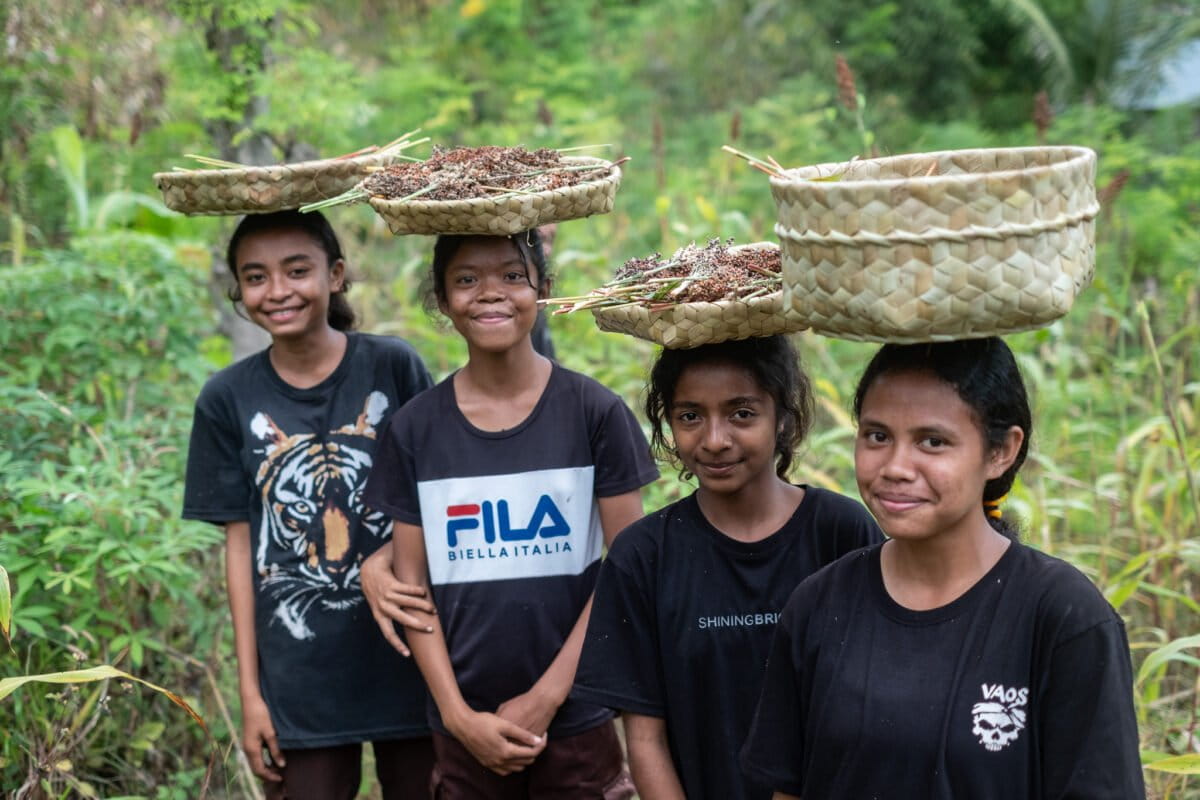 The cheerful faces of Wulandoni 4 Public Middle School students after harvesting sorghum in the school garden in Tapobali village.