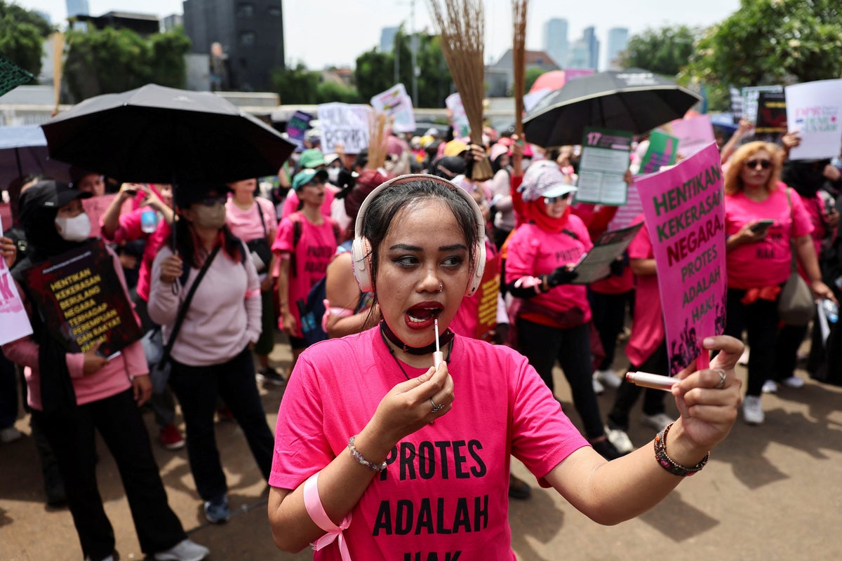 Indonesia protests: Why women dressed in pink are joining demonstrations with brooms