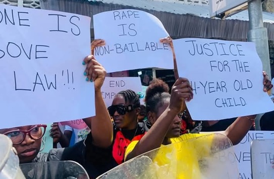 PROTESTERS DEMAND ARREST OF SUSPENDED DEPUTY MINISTER BRYANT MCGILL OVER RAPE ALLEGATION