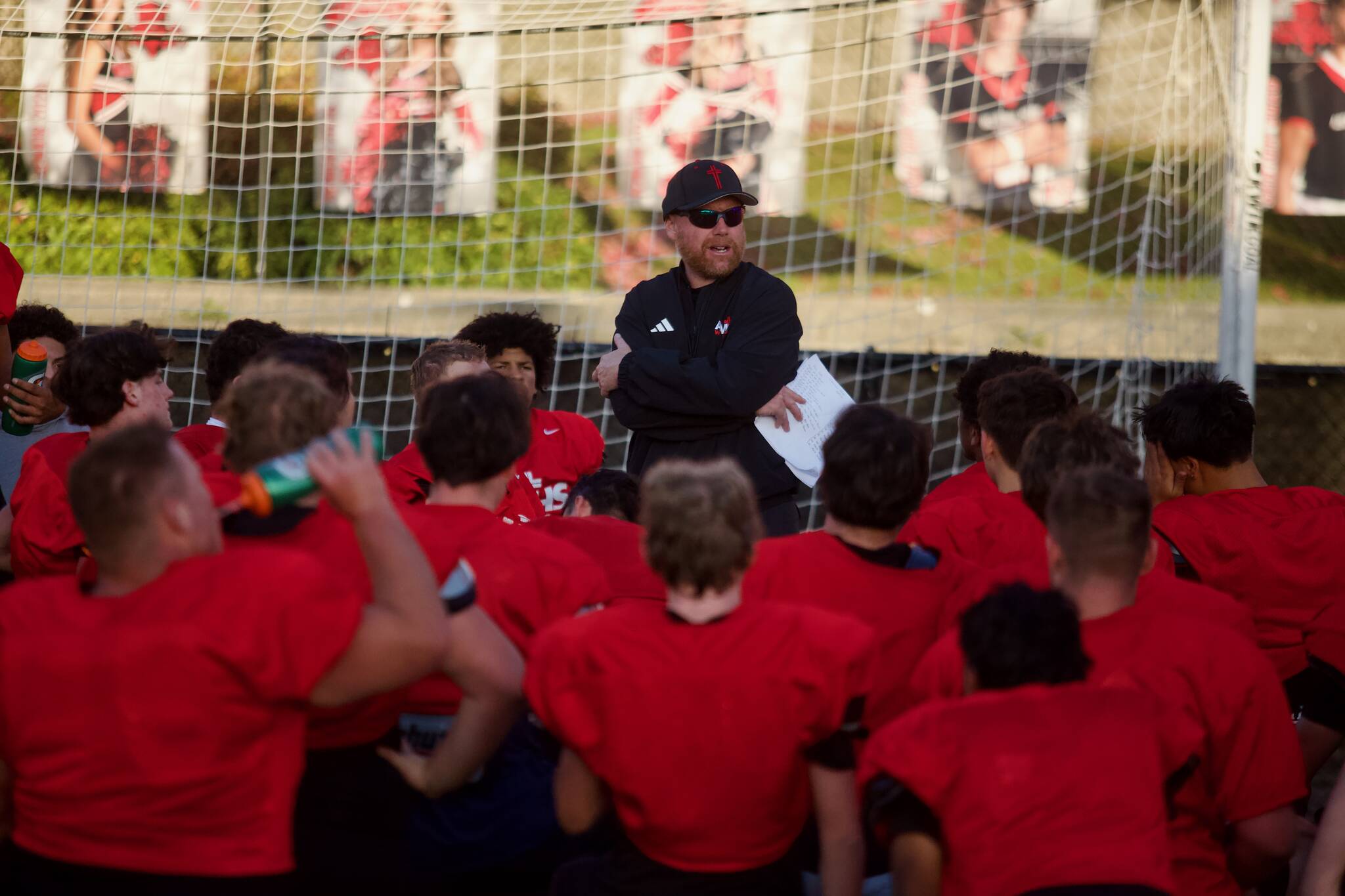 Archbishop Murphy football coach Joe Cronin addresses the team following practice at Terry Ennis Stadium on Oct. 15, 2025. (Joe Pohoryles / The Herald)