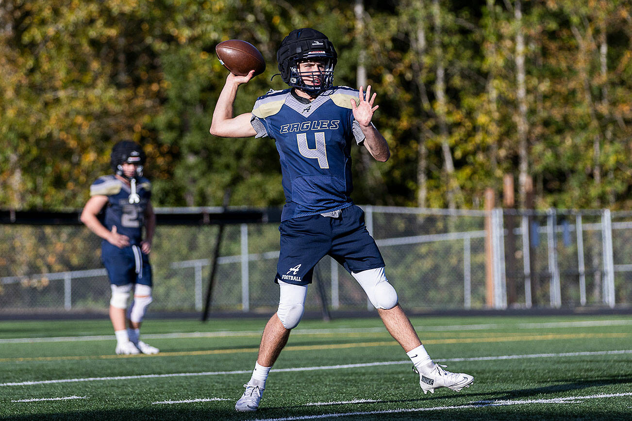 Arlington’s Kaleb Bartlett-Wood throws a pass during practice on Oct. 8, 2025 in Arlington, Washington. (Olivia Vanni / The Herald)