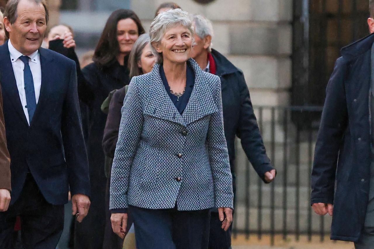 Catherine Connolly (C) smiles as she arrives at Dublin Castle, after being declared the winner in the Presidential election to become the next President of Ireland in Dublin on Oct. 25, 2025. (AFP Photo)