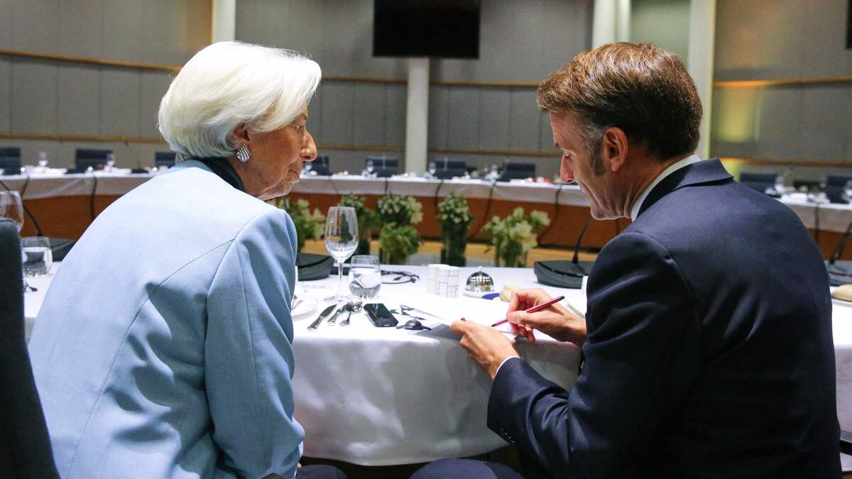 European Central Bank (ECB) President Christine Lagarde speaks with France's President Emmanuel Macron during a European summit in Brussels on 23 October 2025