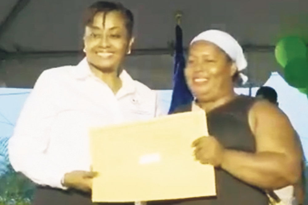 Eighty-four North Windward residents receive title deeds