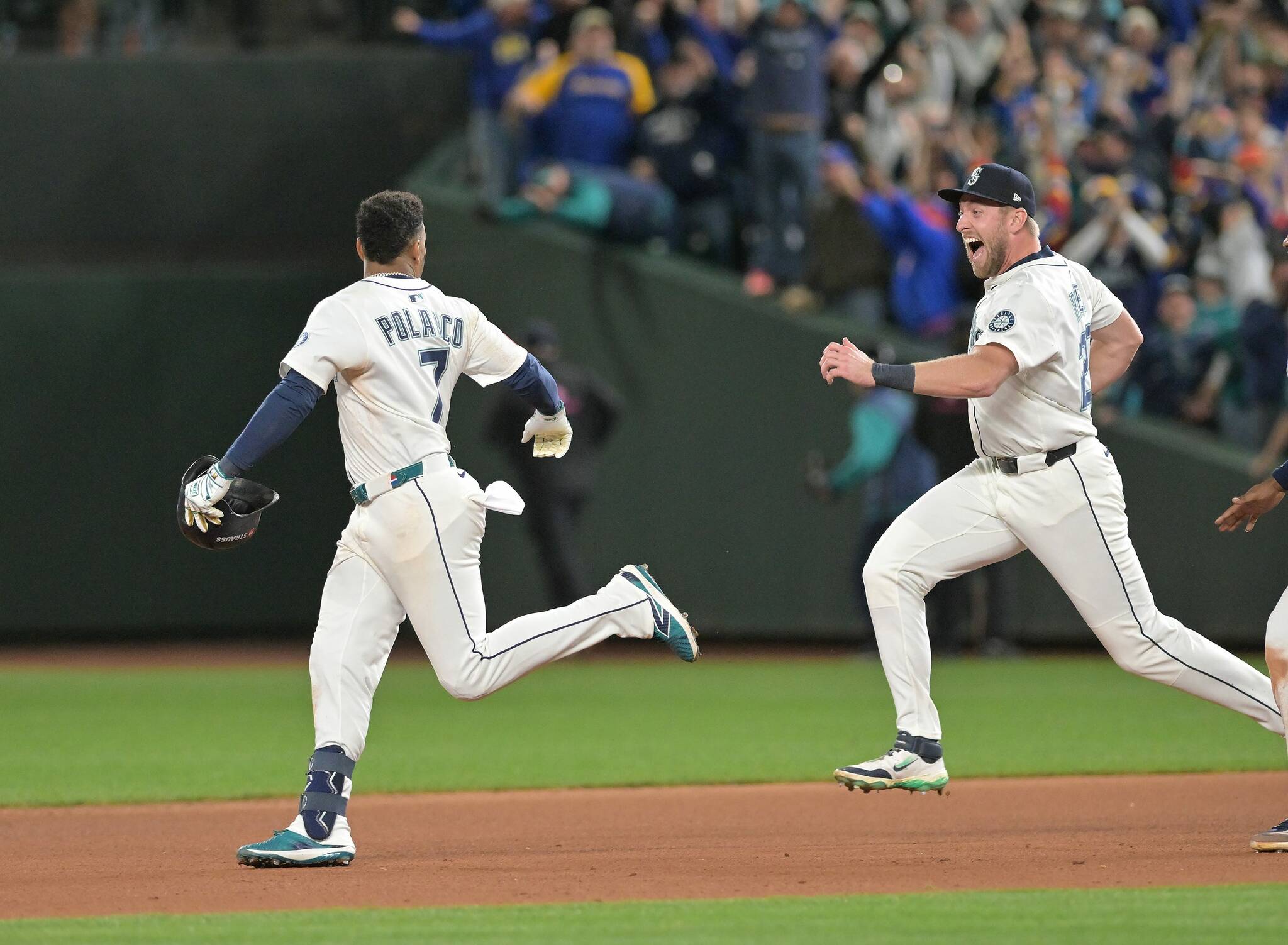 Mariners Luke Raley, right, runs out to celebrate with Jorge Polanco after Polanco’s single wins the game as the Detroit Tigers take on the Seattle Mariners in Game 5 of the ALDS at T-Mobile Park in Seattle, Washington on Friday, October 10, 2025. Mariners win, 3-2, 15 innings. (Robin Buckson / The Detroit News / Tribune News Services)
