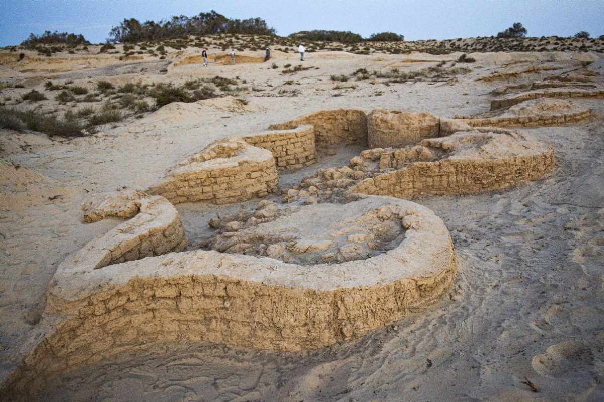 Archaeologists excavate the remains of a massive New Kingdom fortress at Tell el-Kharouba in North Sinai, Egypt