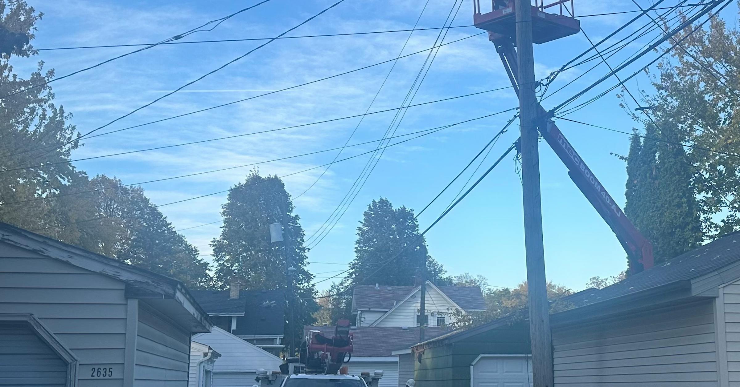 Minneapolis firefighters work to rescue man in bucket truck burned by powerline