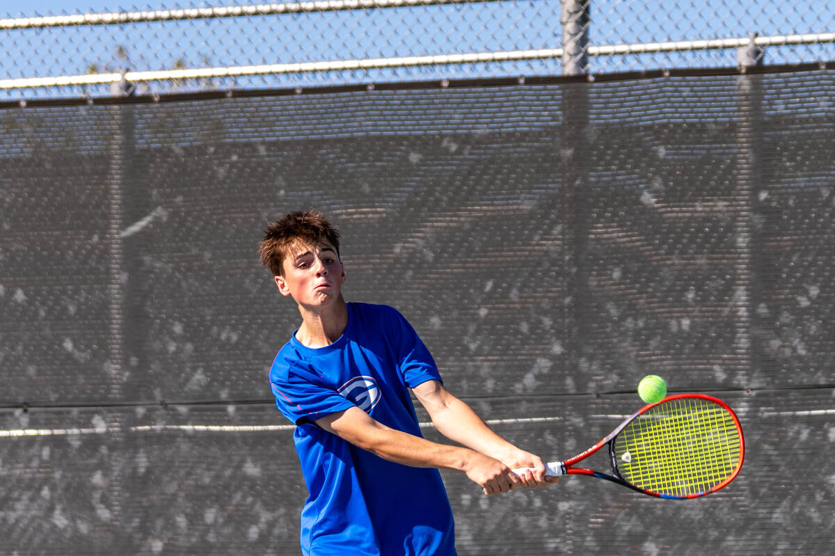 Bishop Gorman’s Lucas Rago returns the ball to Palo Verde’s Balin Gupta during th ...