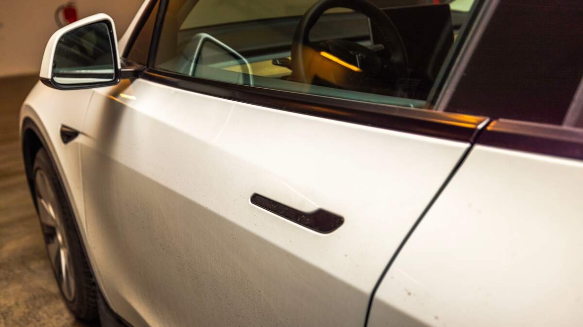 A passerby was reportedly unable to open the door of a Tesla after it crashed and caught fire, killing the driver and two passengers, in Germany last month