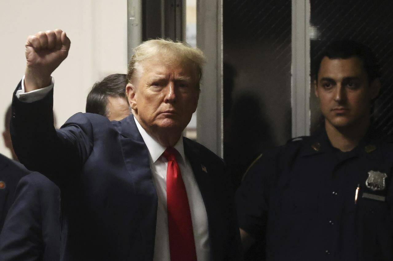 Former President Donald Trump reacts as he walking back into the courtroom after a break during closing arguments in his hush money trial at Manhattan criminal court in New York, Tuesday, May 28, 2024. (Spencer Platt/Pool Photo via AP)