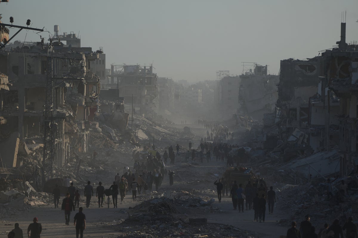 Palestinians return to ruins as aid groups push to scale up deliveries and US troops land in Israel