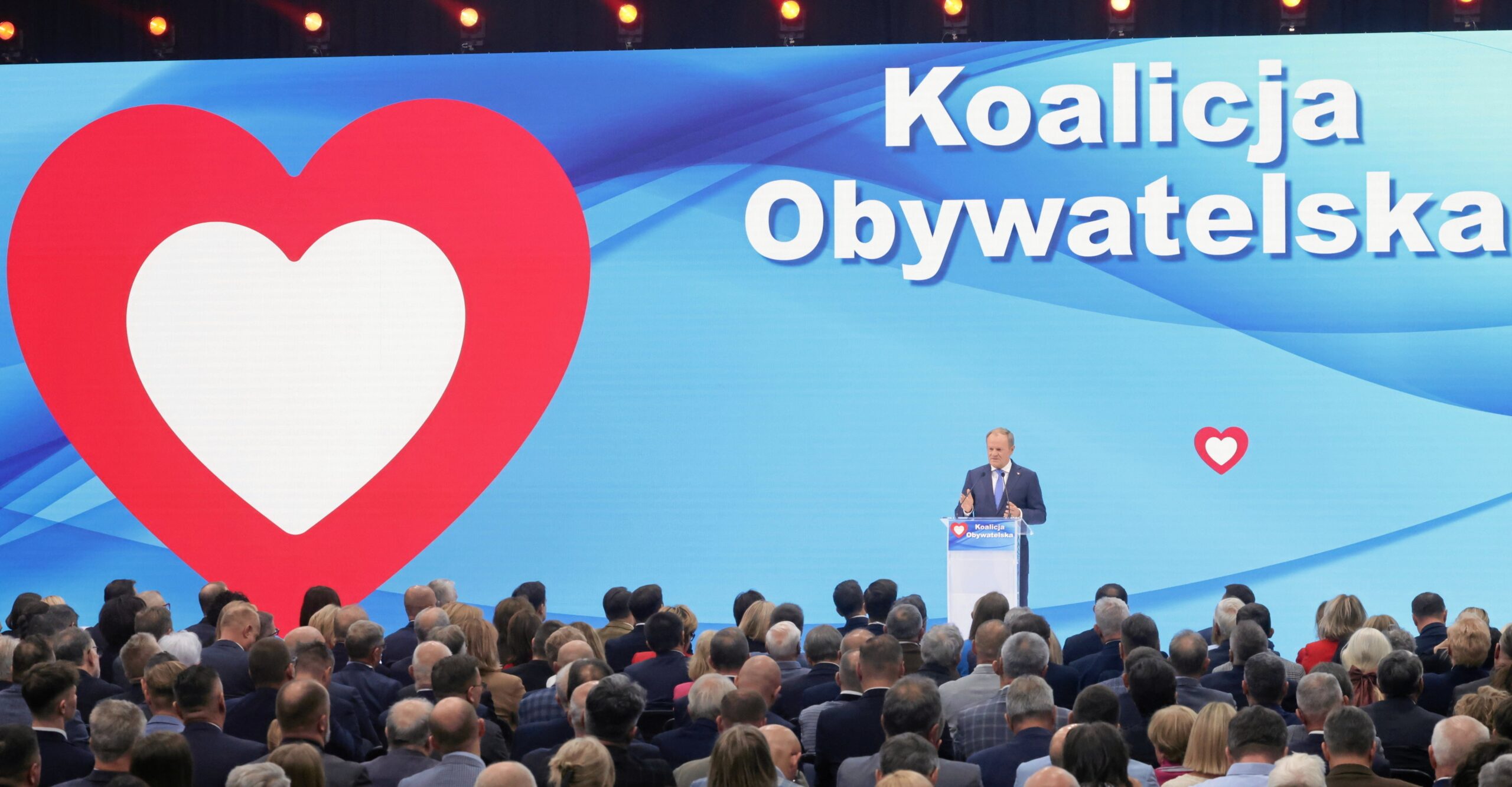 Poland’s main ruling party changes name and merges with junior partners