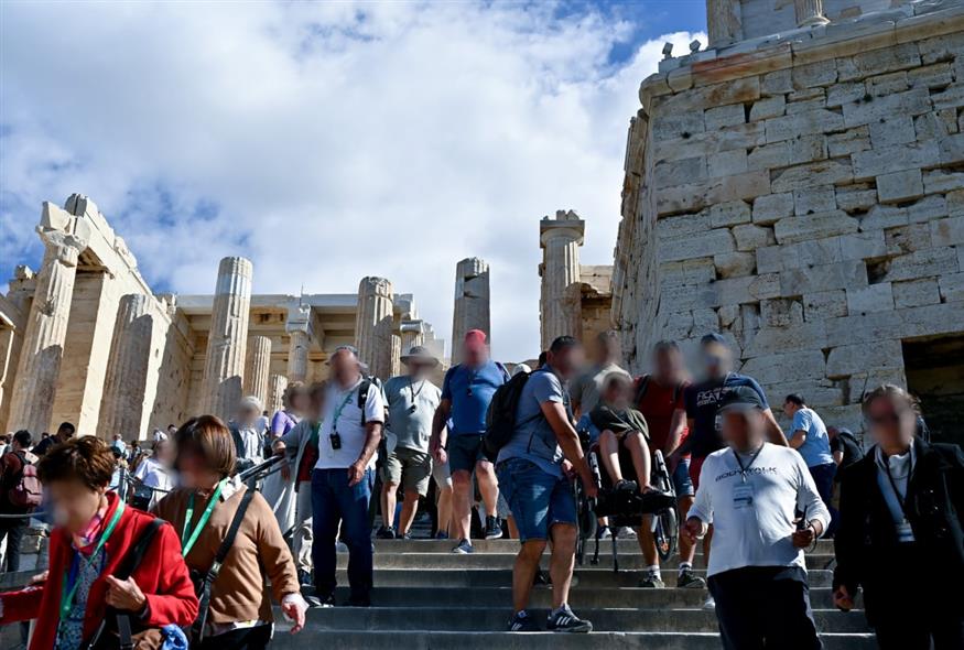Tourists in wheelchairs carried by hands as Acropolis elevator out of order