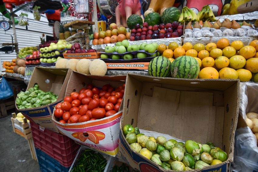 fruits and vegetables on display at a market