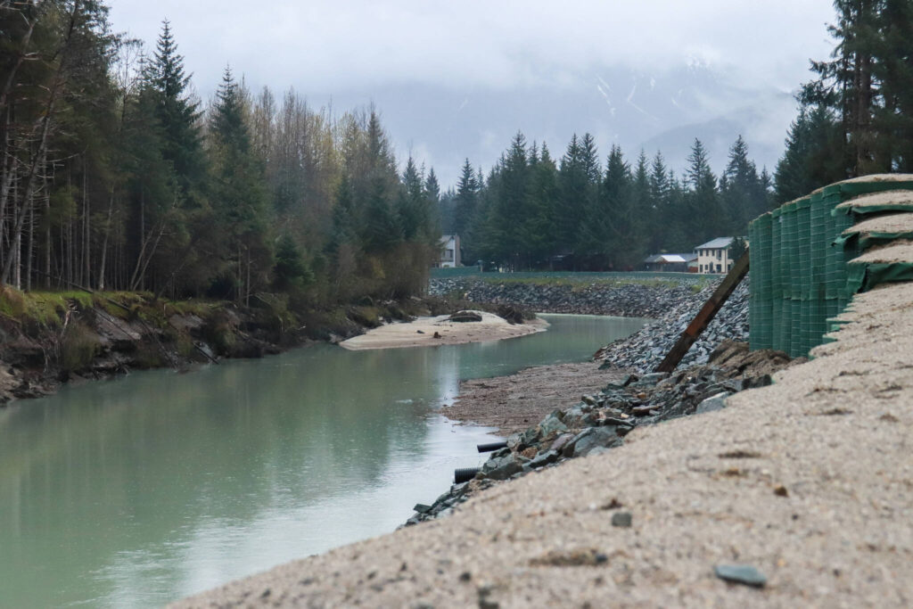 HESCO barriers line the Mendenhall River on Monday, May 12, 2025. (File photo, Jasz Garrett/Juneau Empire)