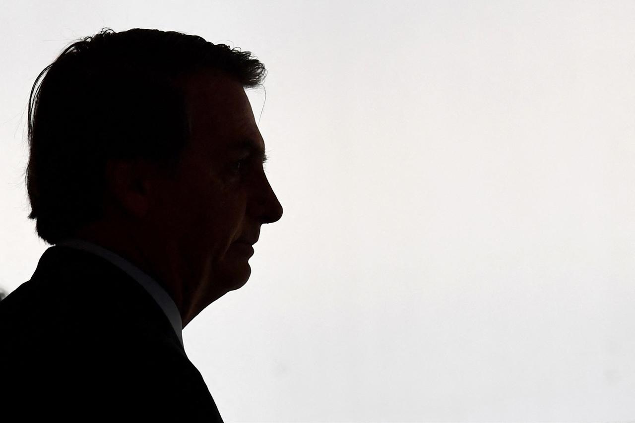 The silhouette of Brazilian President Jair Bolsonaro is seen as he arrives for the Armed Forces General Officers promotion ceremony at Planalto Palace in Brasilia on Dec. 9, 2019. (AFP Photo)