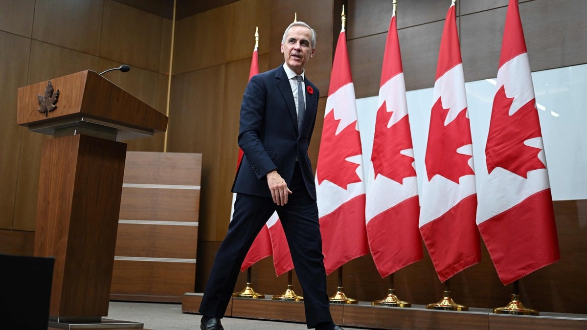 Canada's Prime Minister Mark Carney leaves after attending a press conference after the 2025 Asia-Pacific Economic Cooperation (APEC) Economic Leaders' Meeting in Gyeongju on November 1, 2025. (Photo by JUNG Yeon-je / AFP)