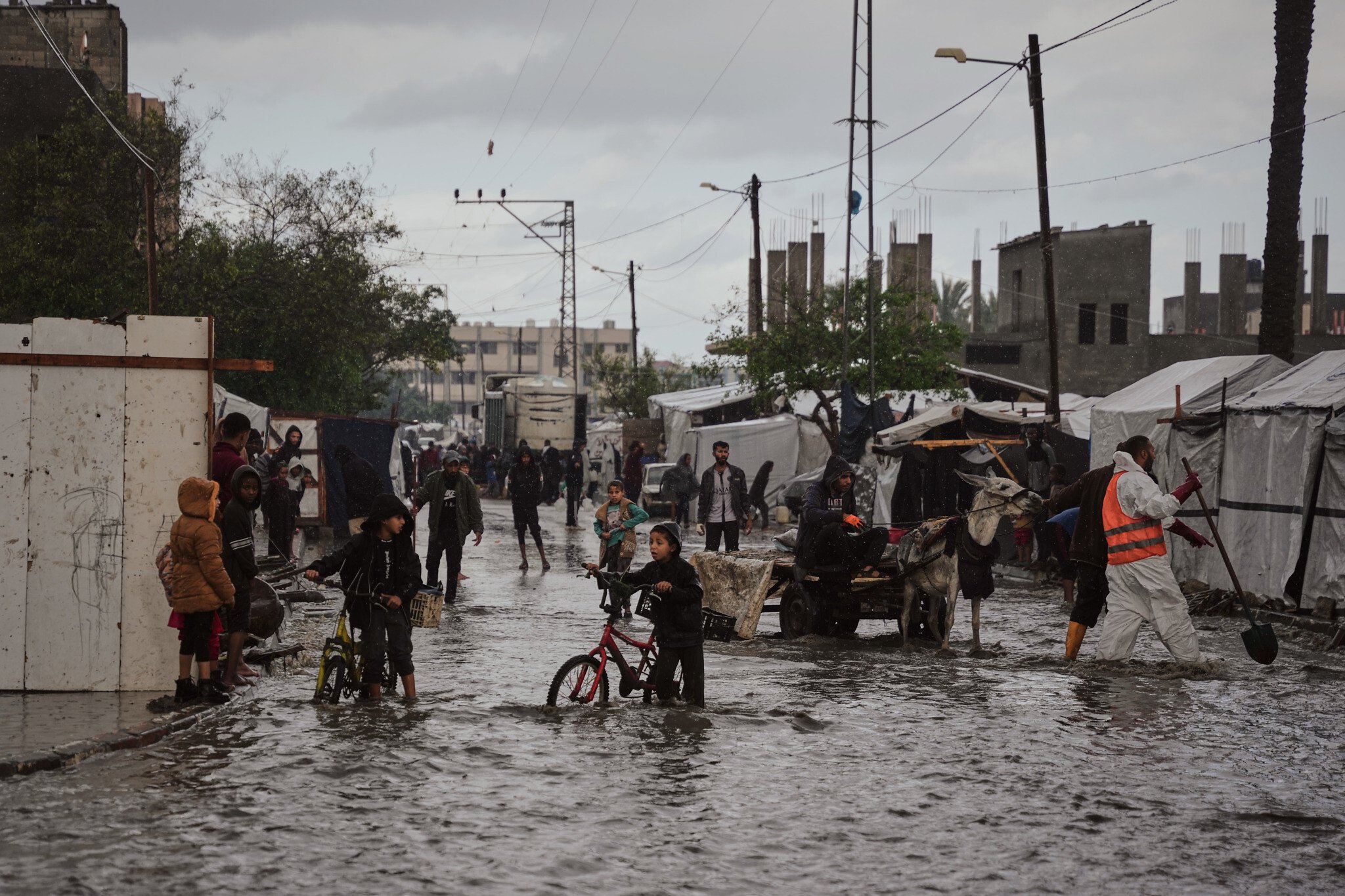 'Everything is soaked': Rain floods Gaza tents, amid efforts to ramp up aid