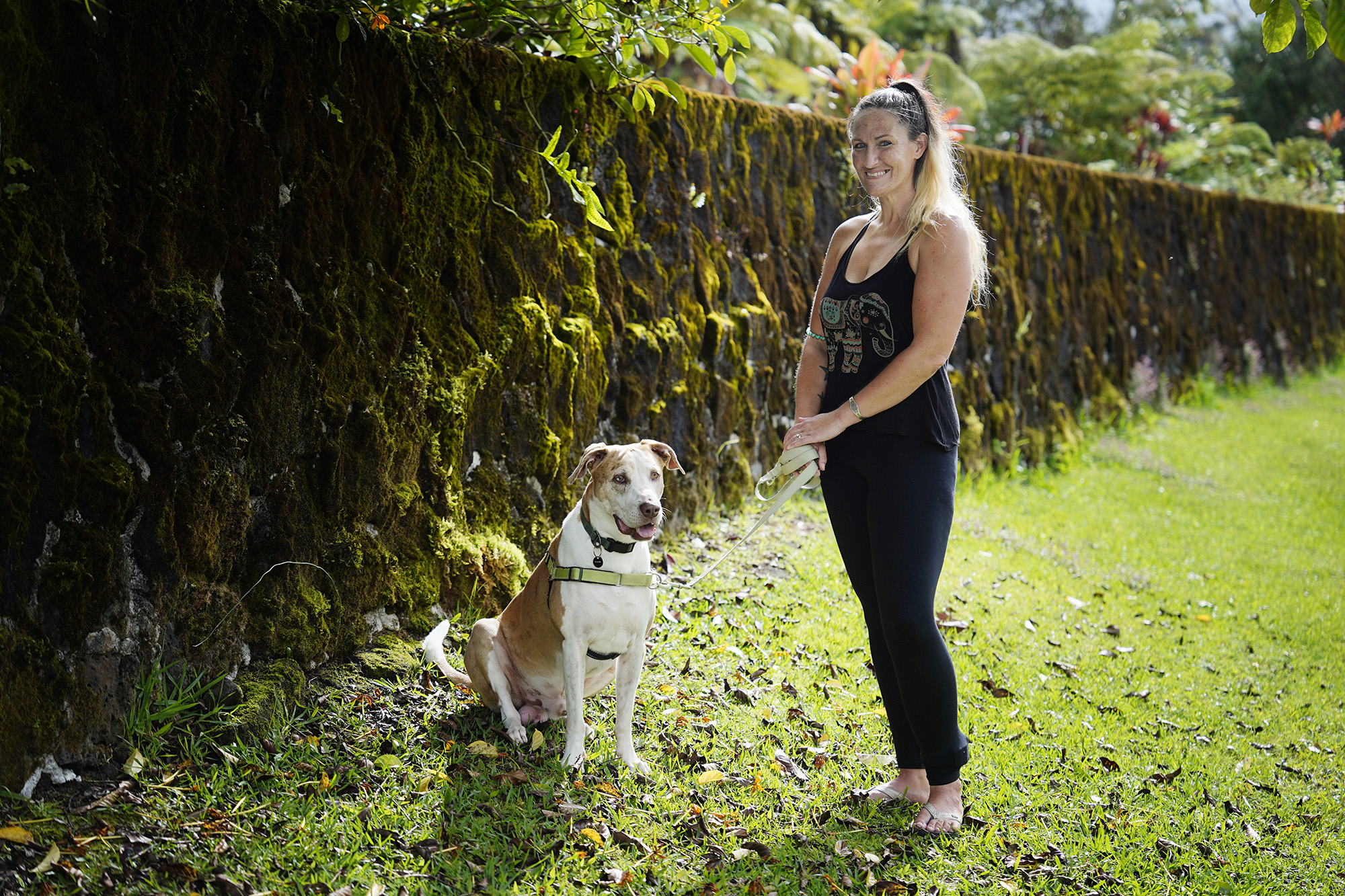 Heather Hofferbert and her dog Trippy are photographed Friday, Oct. 31, 2025, in Hilo. The two were staying in a domestic-abuse shelter and were forced to move to Hilo after funding was cut. (Kevin Fujii/Civil Beat/2025)