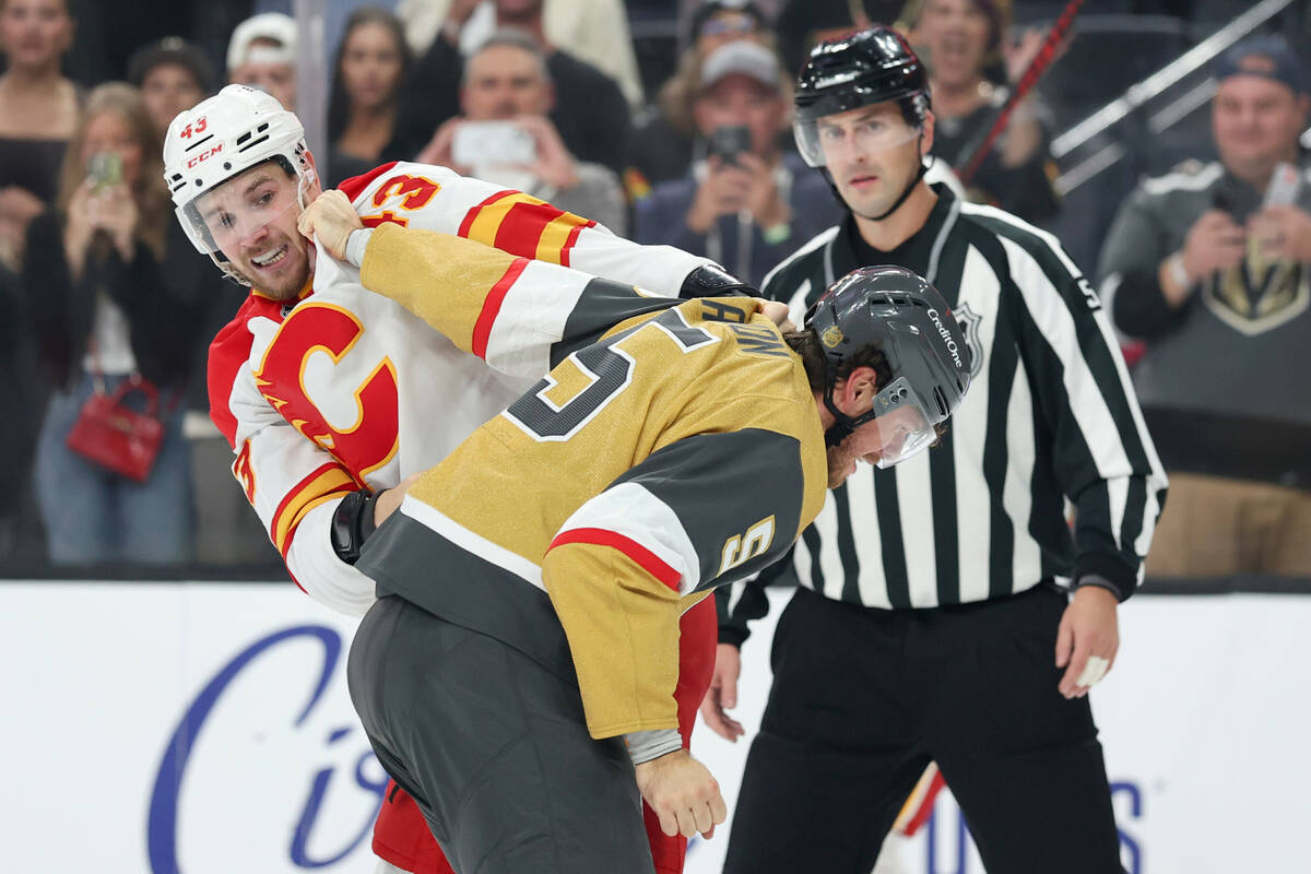 Calgary Flames right wing Adam Klapka (43) and Vegas Golden Knights defenseman Jeremy Lauzon (5 ...