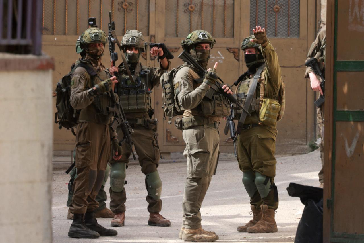 Israeli soldiers gesture during a raid at the Balata refugee camp east of Nablus city in the occupied West Bank, Palestine, Aug. 11, 2025. (AFP Photo)