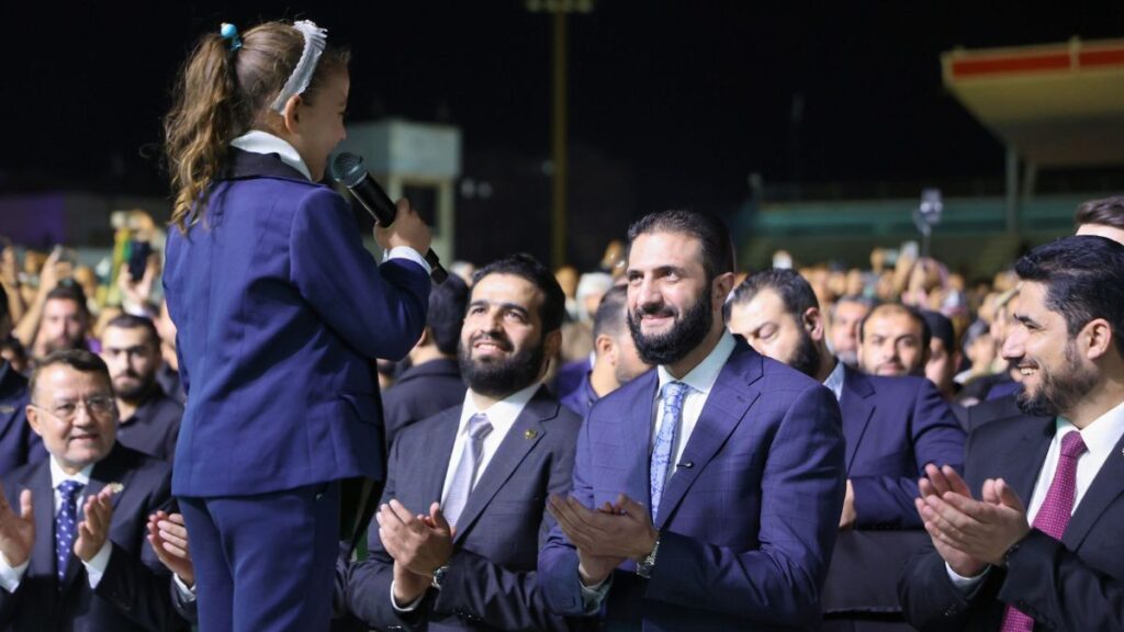 Syrian President Ahmad al-Sharaa and Interior Minister Anas Khattab attend an event in Idlib (northwest Syria), September 27, 2025 (Syrian Presidency)