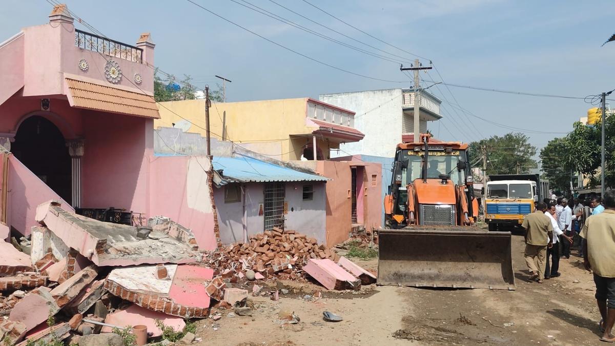 Vellore Corporation lays concrete carriageway without relocating electrical poles