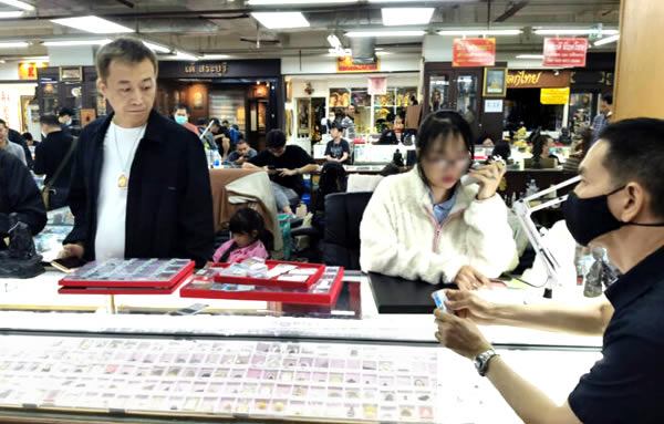 Chinese and Burmese men arrested for flouting immigration and labour laws selling amulets