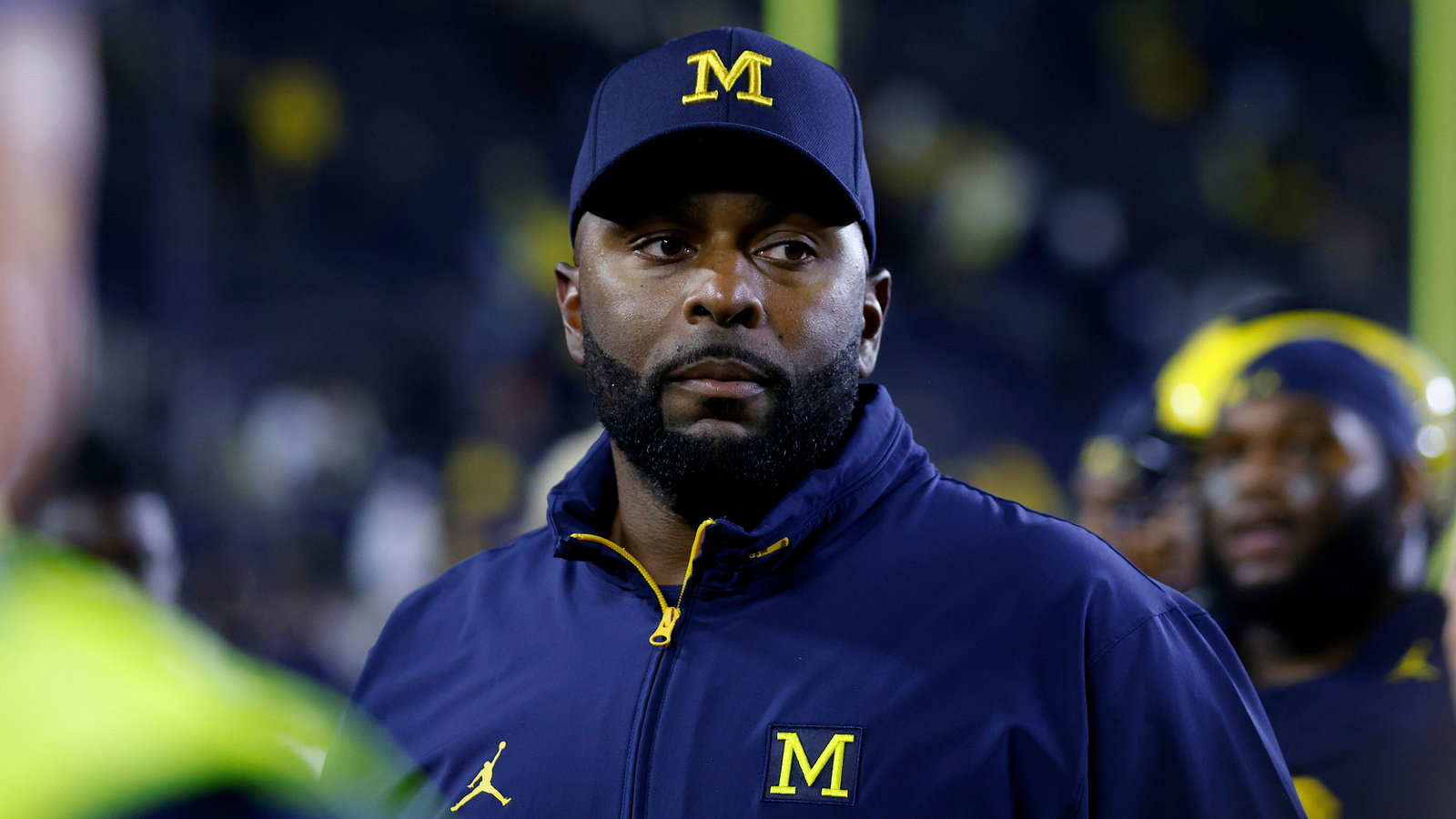 Fired Michigan football coach Sherrone Moore is charged with three crimes, including home invasion and stalking a person he dated