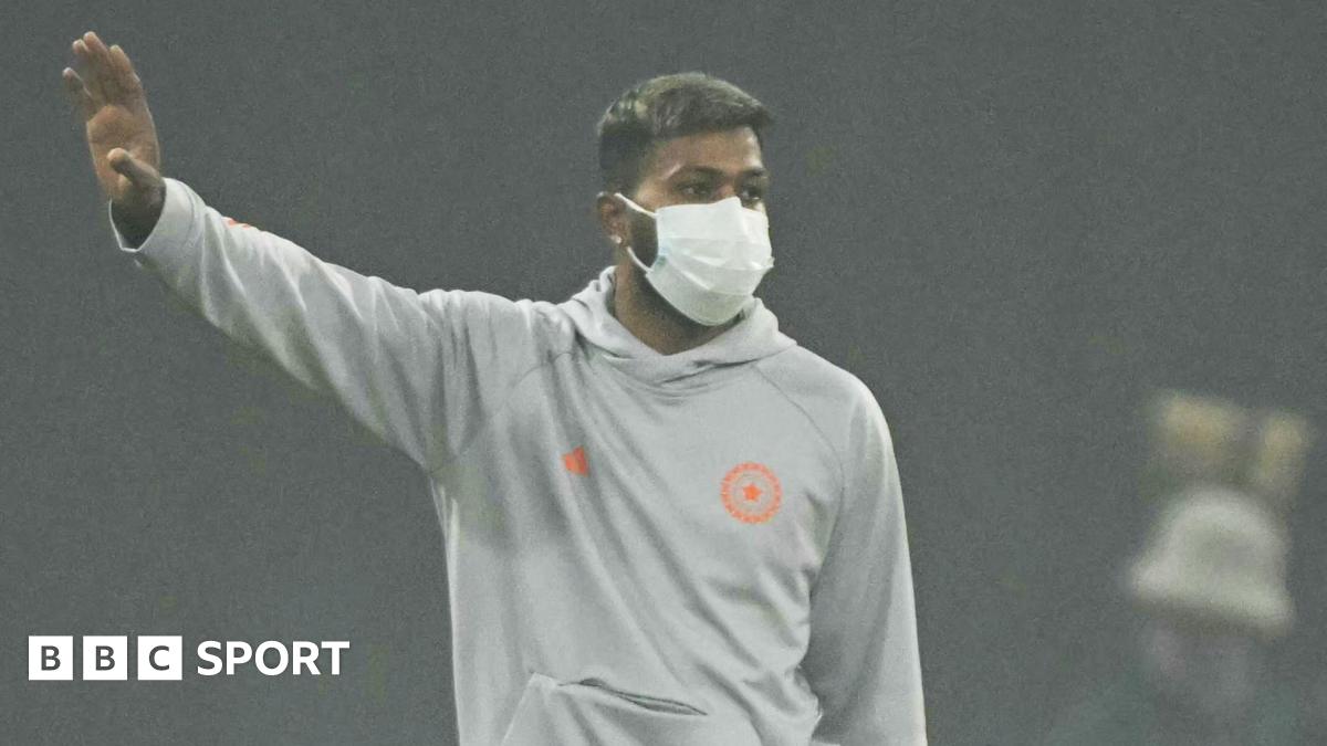 India all-rounder Hardik Pandya wears a mask during the warm-up for the abandoned match against South Africa