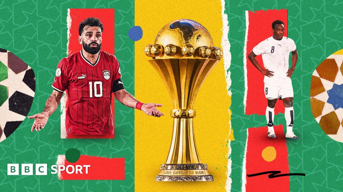 A colourful graphic showing Mohamed Salah on the left shrugging his shoulders in a red Egypt shirt, the Africa Cup of Nations trophy in the centre and Michael Essien looking dejected with hands on hips in an all-white Ghana kit