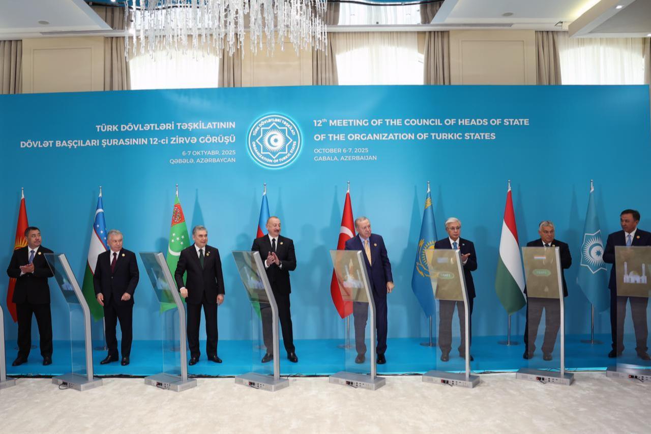 Turkish President Recep Tayyip Erdogan (4th R), Azerbaijani President Ilham Aliyev (C), Uzbek President Shavkat Mirziyoyev (3rd L), Kyrgyz President Sadyr Japarov (2nd L), Kazakh President Kassym-Jomart Tokayev (3rd R), Turkmen National Leader Gurbanguly Berdimuhamedov (4th L), Hungarian Prime Minister Viktor Orban (2nd R), Turkish Republic of Northern Cyprus (TRNC) President Ersin Tatar (L), and OTS Secretary General Ambassador Kubanychbek Omuraliyev (R) attend the 12th Meeting of the Council of Heads of State of the Organization of Turkic States at Heydar Aliyev Congress Center in Gabala, Azerbaijan on Oct. 7, 2025. (AA Photo)