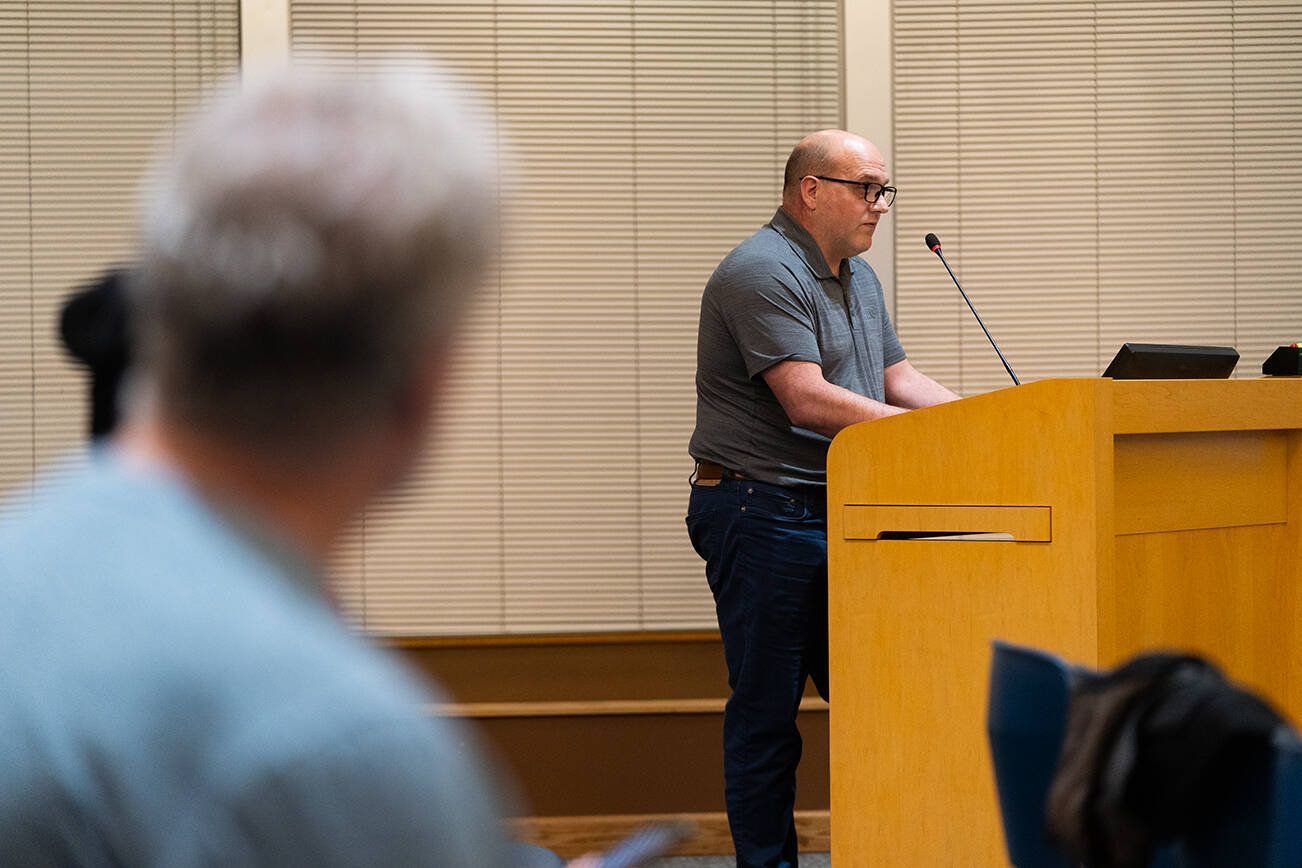 Bob Danson, the general manager of the Olympic View Water and Sewer District, speaks to the Edmonds City Council in favor of an updated critical areas ordinance on Tuesday, Jan. 6 in Edmonds, Washington. (Will Geschke / The Herald)