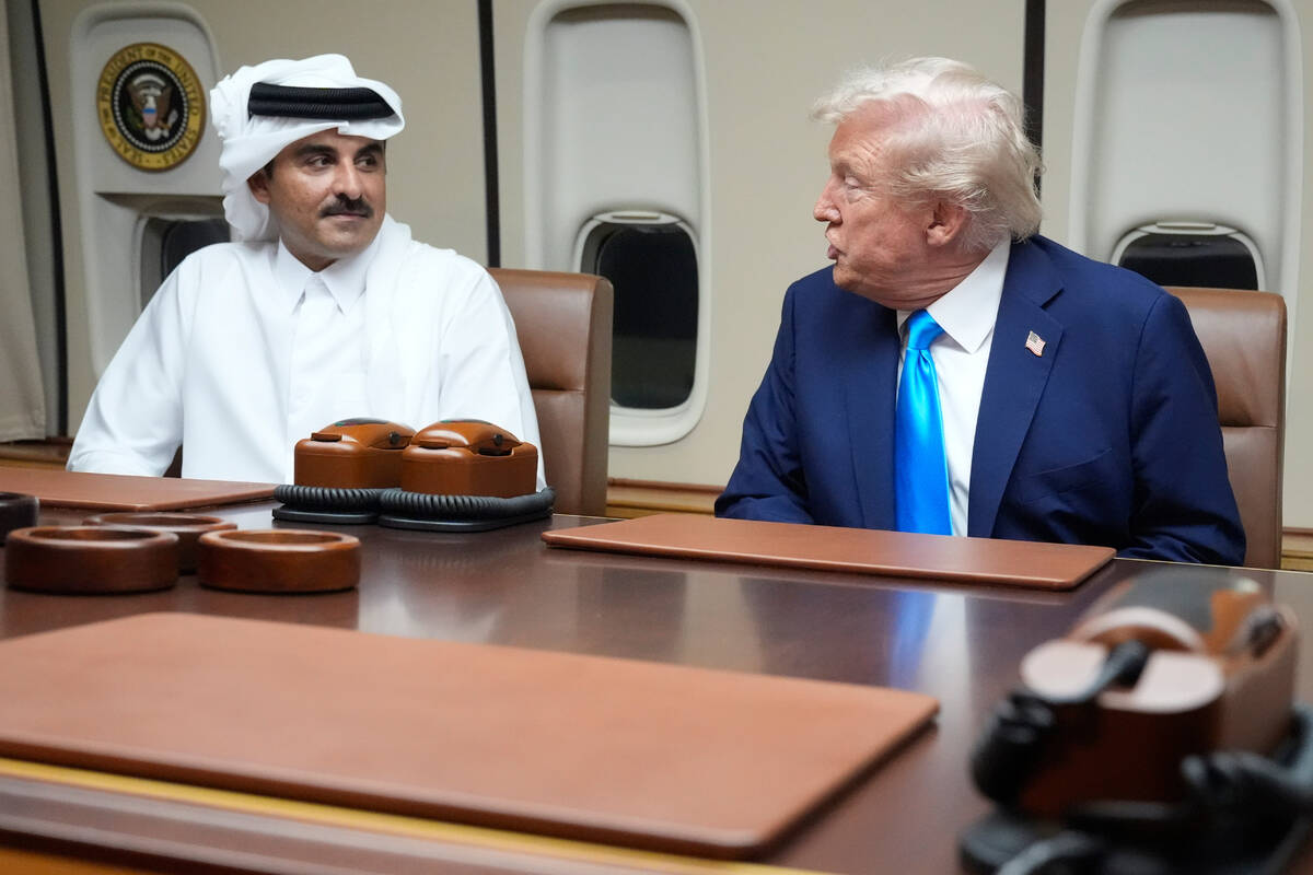 FILE - President Donald Trump, right, meets with Emir of Qatar Sheikh Tamim bin Hamad al-Thani& ...