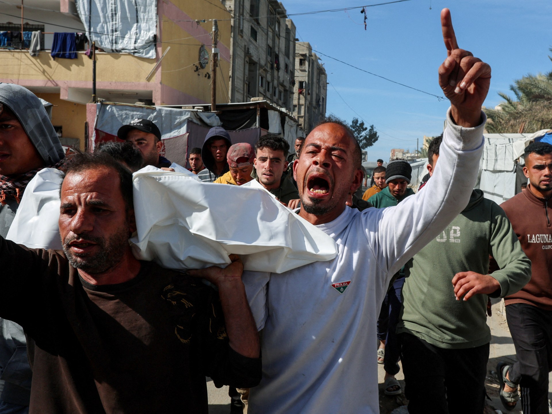 Israel hands over 15 bodies of Palestinians in last stage of captive swap | Gaza News