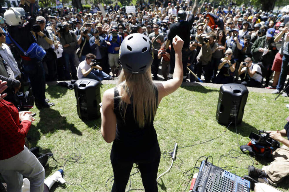In this April 27, 2017, file photo, Lauren Southern wears a protective helmet as she speaks during a rally for free speech near the University of California, Berkeley campus in Berkeley, Calif.  (AP Photo/Marcio Jose Sanchez, File)